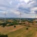 A windmills in a field Description automatically generated